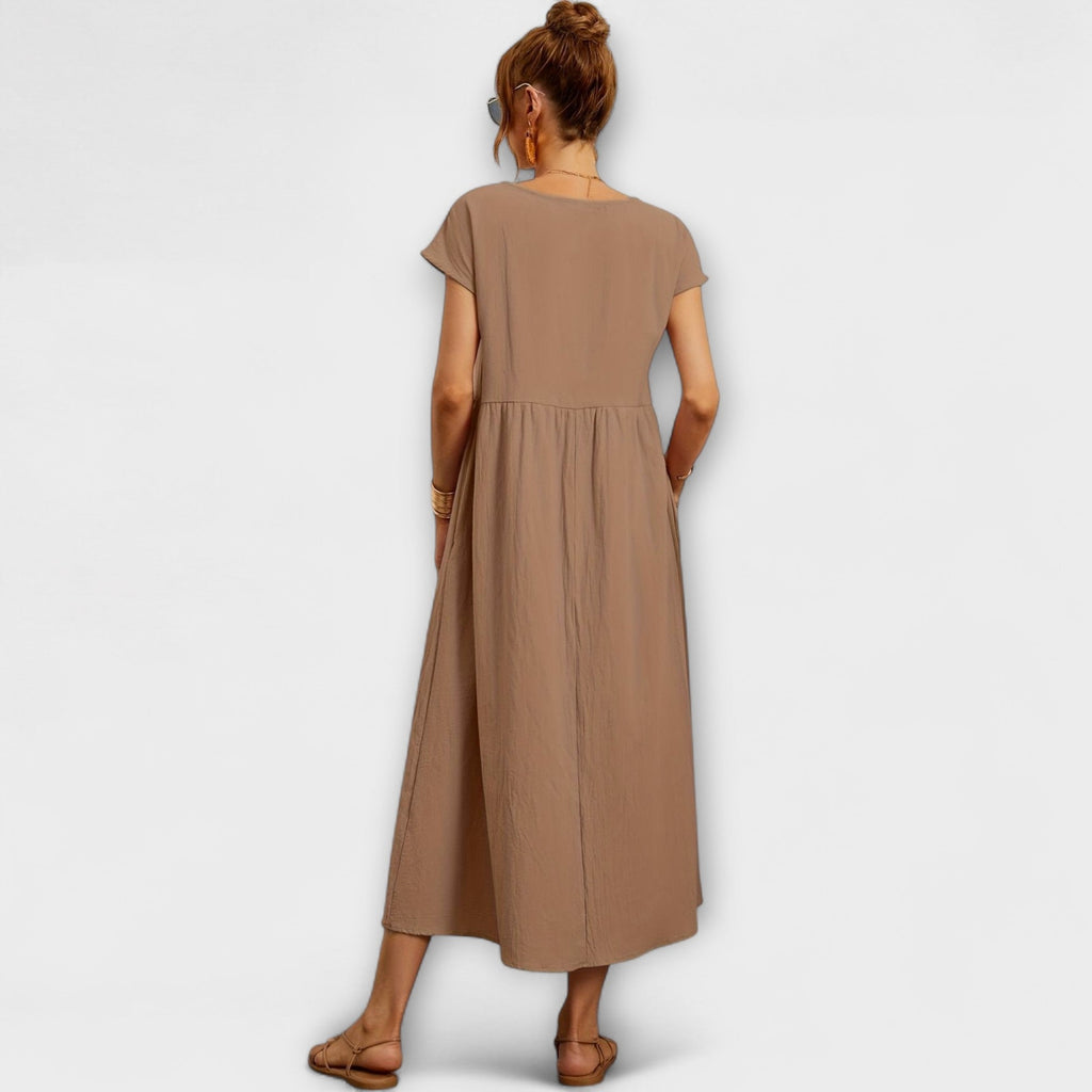 Rochie midi cu linie simplă și buzunare laterale