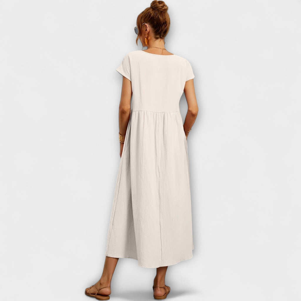 Rochie midi cu linie simplă și buzunare laterale