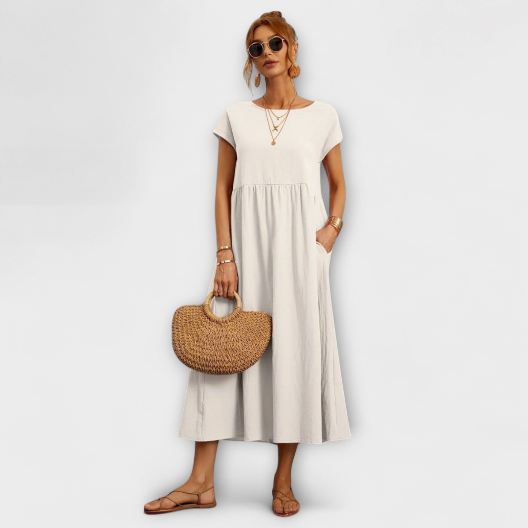 Rochie midi cu linie simplă și buzunare laterale